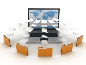 3D image of paper files going into a computer