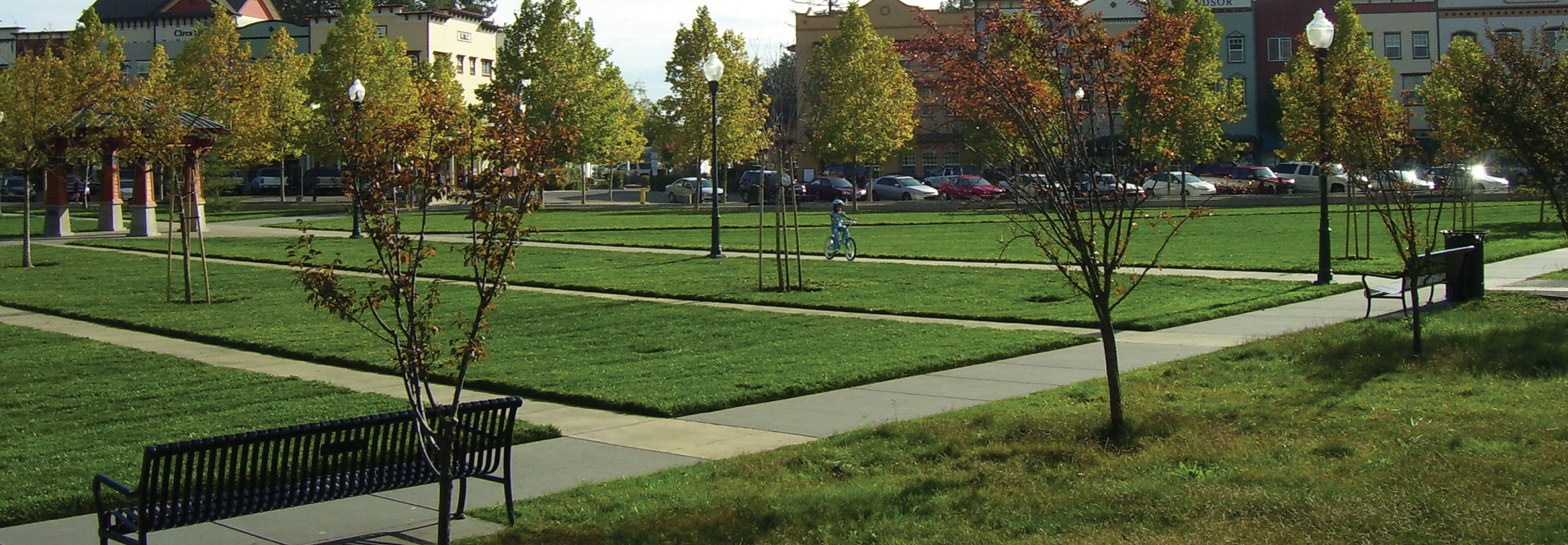 A park in the Town of Windsor with benches and fall trees. The Town uses GIS for parks and recreation.