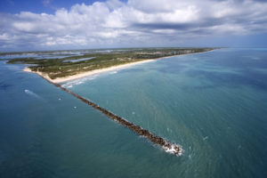 Aerial view of jetty and beach on Fort Pierce, Florida